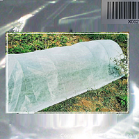 Photo of garden grow tunnel in use outdoors, covered over plants to provide frost protection.