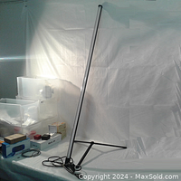 Full vertical view of the indoor plant grow light with its base, showing the upright LED panel on a black metal T-shaped stand against a white backdrop.