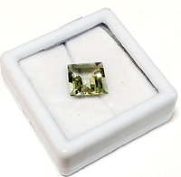 Square cut natural green amethyst gemstone displayed in a white jewelry box with a soft cushion base.