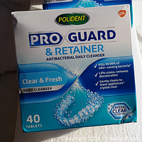 Box front of Polident Pro Guard & Retainer antibacterial daily cleanser showing product branding and features.