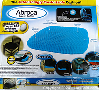 Photo of Abroca seat cushion packaging showing product details and features including honeycomb design, pressure absorption, and usability at home, office, and car.