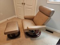 Chair and ottoman angled, showing full set and base design