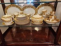 Full set displayed on cabinet shelf