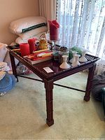 Overall view of rectangular table with gallery edge and decorative items on top