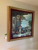 Full view of the framed oil painting depicting a terrace scene with floral still life
