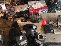 Overview of loose and boxed audio components on floor