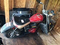 Left side view showing overall minibike profile, seat, tank and engine