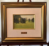 Framed lithograph showing entire frame and print titled "Evergreen" on easel