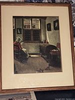 Full view of framed print showing woman reading by window in a historic interior.