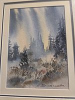 Front view of framed watercolor painting showing forest scene with northern lights, signed E. Briacombe.