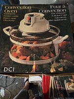 Box of DCI convection oven showing product image and features.