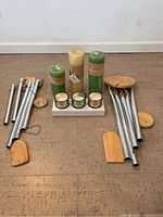 Full view of 3 citronella candles, 3 small candles on tray, and 2 wind chimes