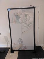Full view of the vintage Chinese translucent screen standing upright showing full frame and base.