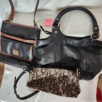 Overview of three purses: small DKNY monogram fabric purse, large black leather The Sak purse, medium black and brown leather Ricardo purse.
