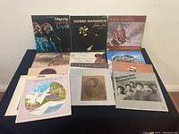 Front view showing 15 vinyl record covers including Marvin Gaye, Dionne Warwick, Stevie Wonder, B.B. King, Johnny Nash, The Commodores and others.