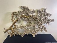 Full view of the floral wall art showing the branch and flowers with gold and off-white tones, 48x30 inches.