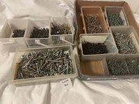 Photo showing containers filled with various screws sorted by size and type
