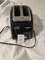 Front view of the T-Fal 2 slice toaster showing slots, controls, and power cord.