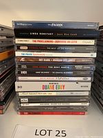 Stack of 17 CDs from various artists and compilations, titles on spines visible for identification.