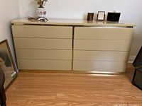 Full front view of the beige Lane dresser showing six drawers and smooth finish.