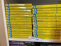 Stack of yellow spine Nancy Drew books arranged side by side showing volume numbers and titles from 14 to 27 in various orders, Grosset & Dunlap publisher branding visible.