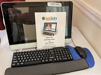 Front view of Telikin 18.6-inch all-in-one computer with keyboard, mouse, wrist rest, and manuals.