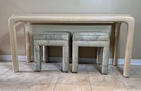 Front view of console table with two stools underneath.
