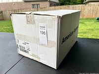 Box showing American Apparel branding with lot number sticker.