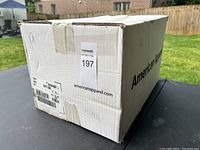 Box labeled American Apparel containing 72 white T-shirts size medium.