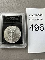 Obverse view of the 2021 American Eagle Silver Dollar coin in protective case showing detailed design of Lady Liberty.