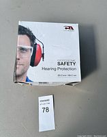 Box for professional safety hearing protection earmuffs showing product image and noise reduction details.