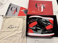 Photo showing Reves Paris high top sneakers in original box, along with branded dust bag and wrapping paper.