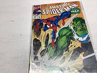 Photo of the comic book The Amazing Spider-Man issue #381 with Spider-Man and Hulk on the cover showing front cover condition.