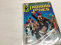 Front cover photo showing Marvel Comics Group The Further Adventures of Indiana Jones comic book issue #1, 1979 edition in a protective sleeve.