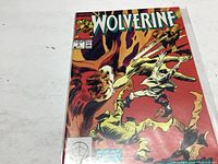 Front cover of Wolverine comic book issue #9 showing action scene and Marvel branding