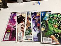 Five DC Comic books displayed fanned out, showing front covers and barcodes.