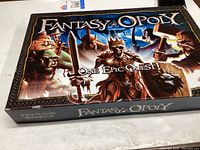 Closed Fantasy-Opoly box showing fantasy-themed artwork and title.
