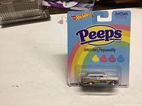 Photograph of unopened Hot Wheels Peeps Delivery diecast truck in blister card packaging.