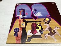 Original RCA Victor album cover for Three Dog Night Golden Biscuits, colorful abstract art, for condition and authenticity verification.