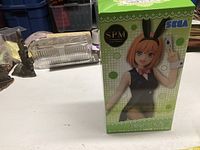 Box front showing green Sega branded packaging with image of Nakano anime figure.