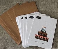 Lot of white seed paper birthday cards and plain brown envelopes