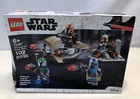 Box front showing LEGO Star Wars Mandalorian Battle Pack 75267 with 4 Mandalorian minifigures and builds, 102 pieces.