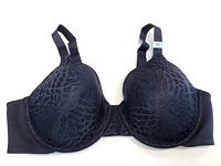Top view of new black women’s bra size 38C showing patterned cups and adjustable straps.