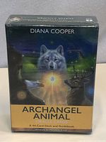 Front of sealed box titled Diana Cooper Archangel Animal Oracle Cards, featuring wolf and other animals artwork