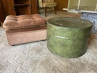 Two ottomans side by side on carpeted floor near furniture.