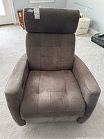 Front view of gray fabric rocking reclining chair showing padded armrests, cushioned back and seat.