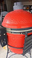 Close-up of red textured ceramic dome and vent cap