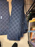 Stack of multiple blue stair step grips showing their texture, pattern and material.