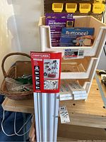 Photo showing Craftsman VersaTrack rack with white stacking bins and various tools inside bins