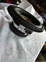 Side profile showing black cone with Memphis logo and rubber surround